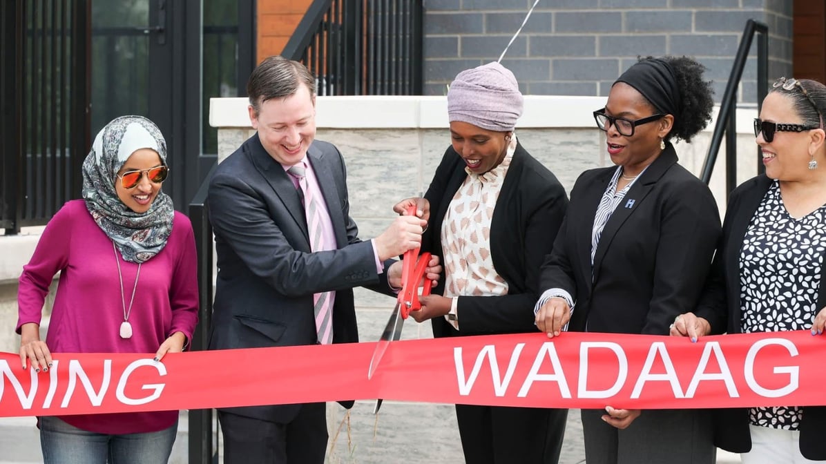 Redesign Executive Director Andy Hestness and Noor Companies CEO Nawal Noor cut the ribbon for Wadaag Commons