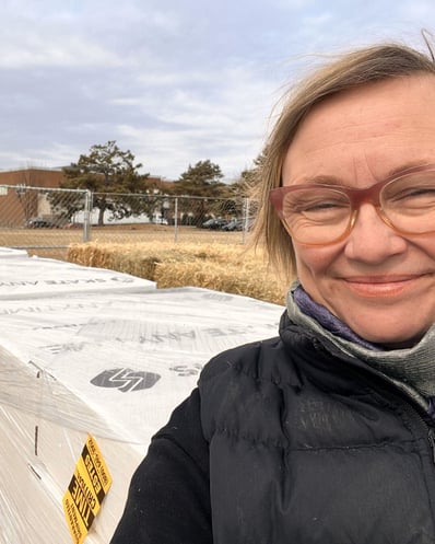Krista installing the synthetic skating rink on Lake Street